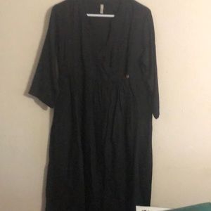 Black cotton V-neck cotton dress. Too small for me. Never been worn.